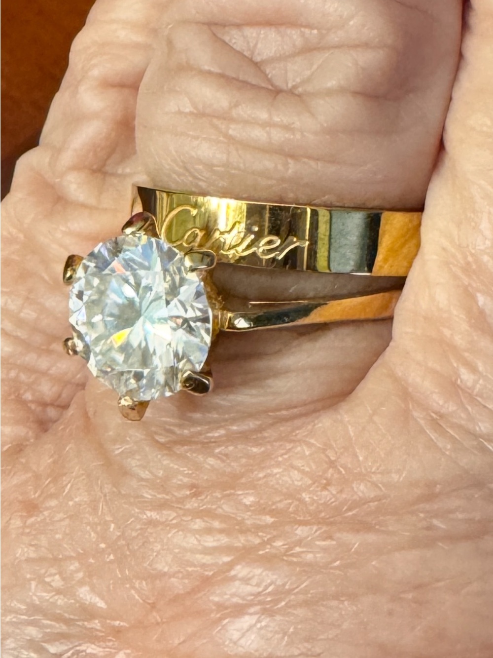 Women's Gold tone Solitaire Ring with Clear Round Moissanite Stone. Size 9